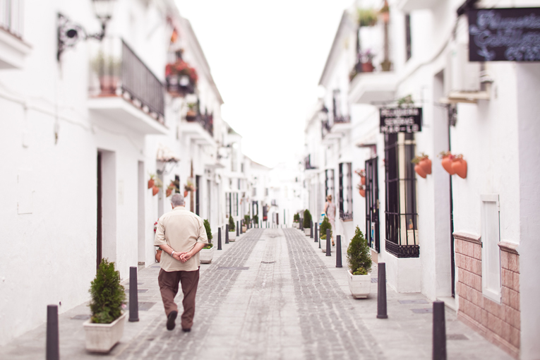 old man taking a stroll on street in Mijas, Spain Toronto Photographer : old man taking a stroll on street in Mijas, Spain