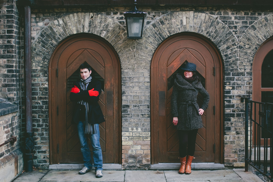 Creative Engagement Photographer in Toronto : couple posing by brown doors