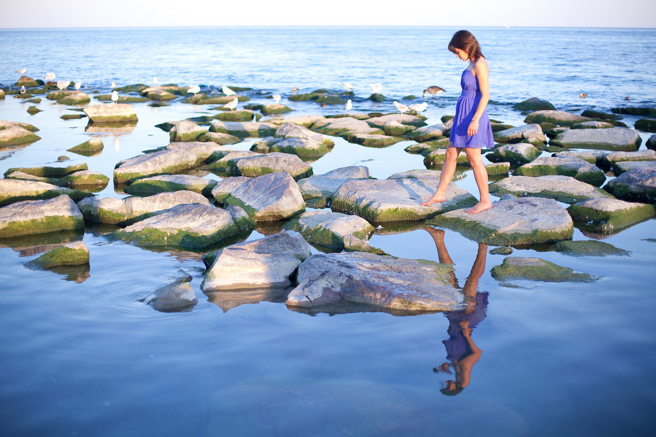 Toronto Adventure Photographer Toronto Adventure Photographer : girl walking on rocks at the Beaches on Lake Ontario