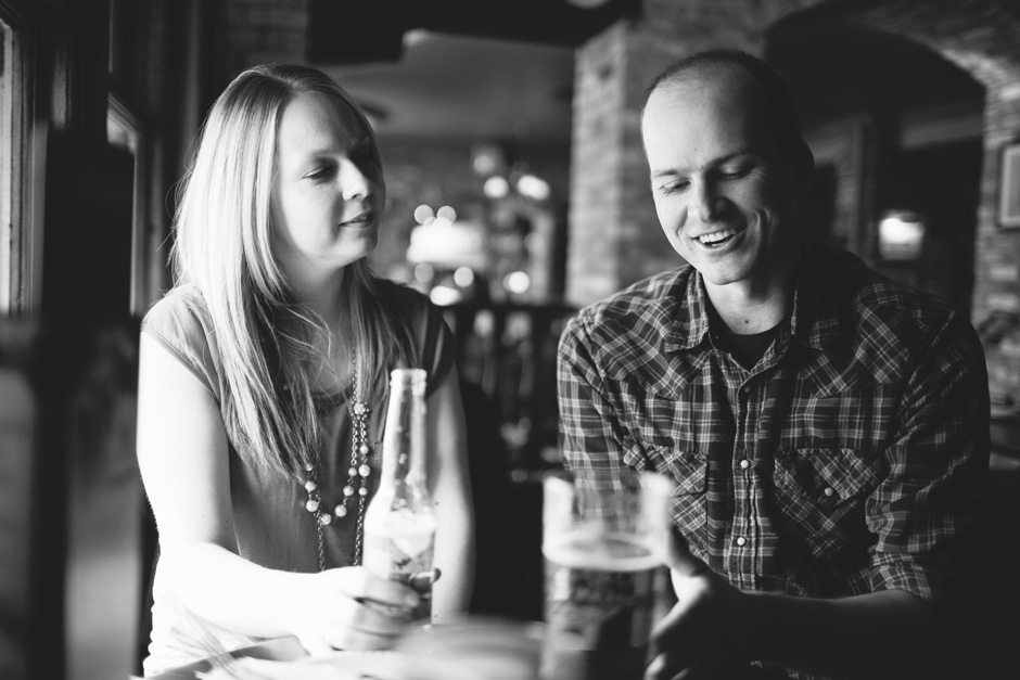 Engagement Photography Toronto: couple chatting in pub
