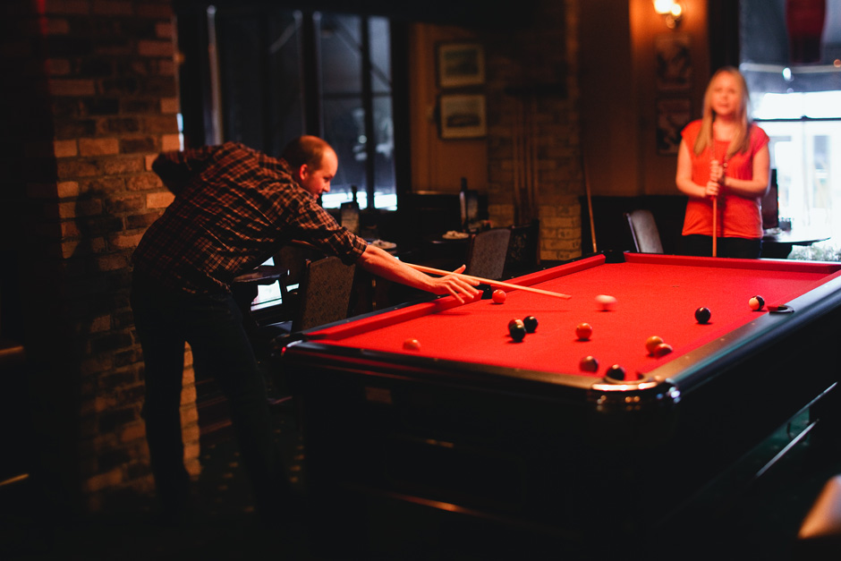 Engagement photos Toronto: couple playing pool