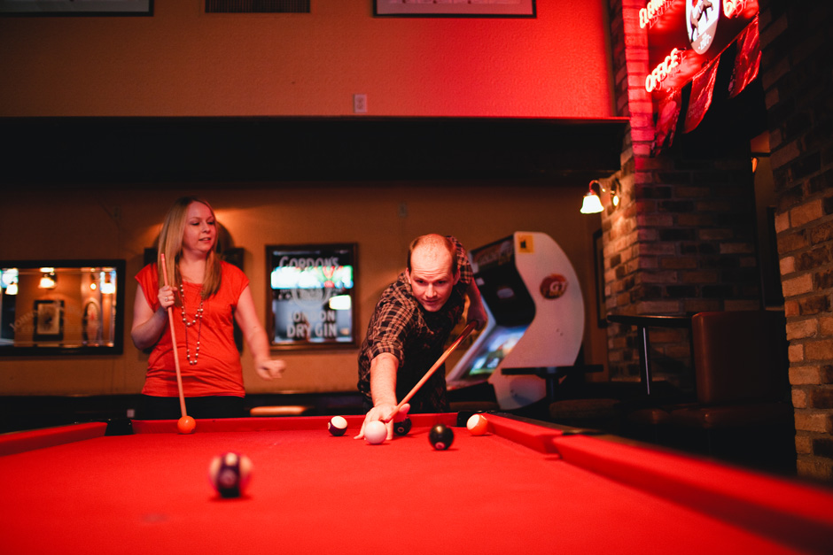 Fun Engagement photographer Toronto - couple playing pool