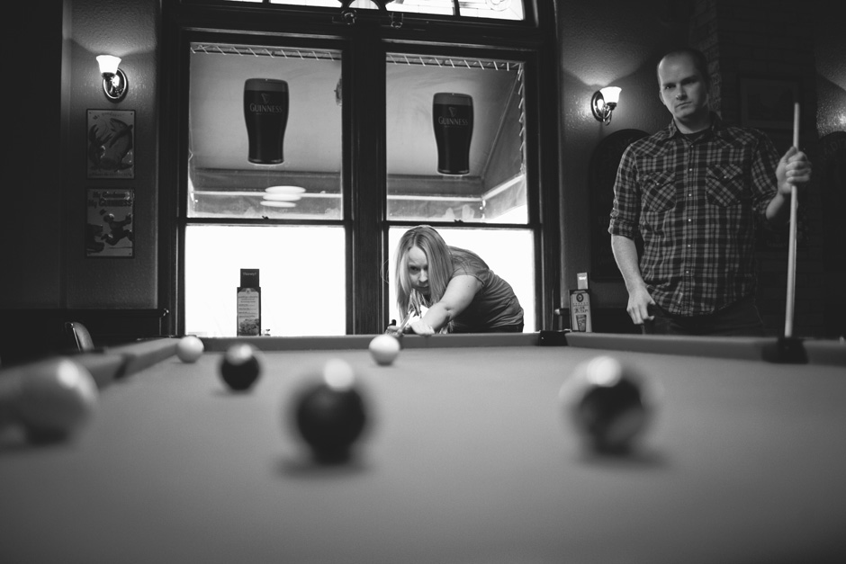Toronto Engagement photos: couple playing billiards