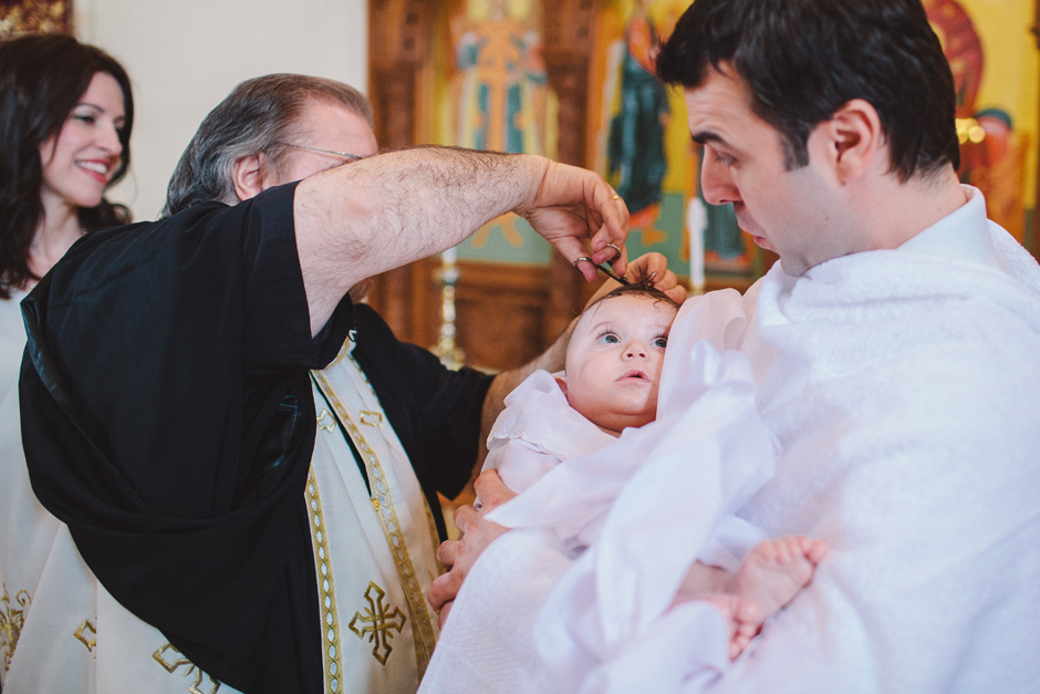 Cutting off a lock of hair at Greek Orthodox Baptism