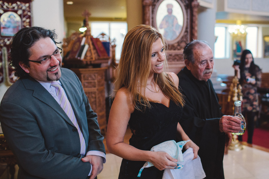 proud parents at Greek Orthodox Baptism