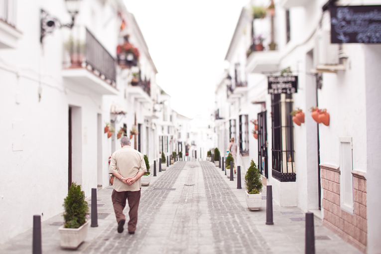 Toronto Photographer : old man taking a stroll on street in Mijas, Spain