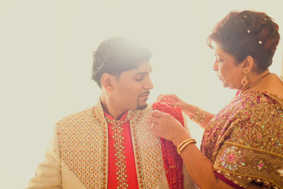 West Indian Toronto wedding Photographer : mother helping Arvin get ready