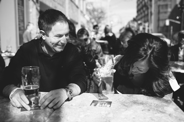 Couple laughing while enjoying beer