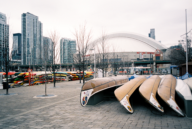 Canoes and kayaks and Rogers Centre in Toronto